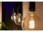 Preview: Philips Hue White E27 White Filament LED Globe Lampe G125 7W - Giant Edison Lampe mit Glühwedel und tunbale White 2200 - 6500 Kelvin